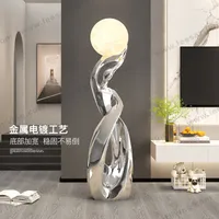 hj-zis202405105-modern-sculpture-holding-ball-led-floor-lamp-for-hotel-lobby-exhibition-lighting
