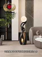 hj-zis202405105-modern-sculpture-holding-ball-led-floor-lamp-for-hotel-lobby-exhibition-lighting